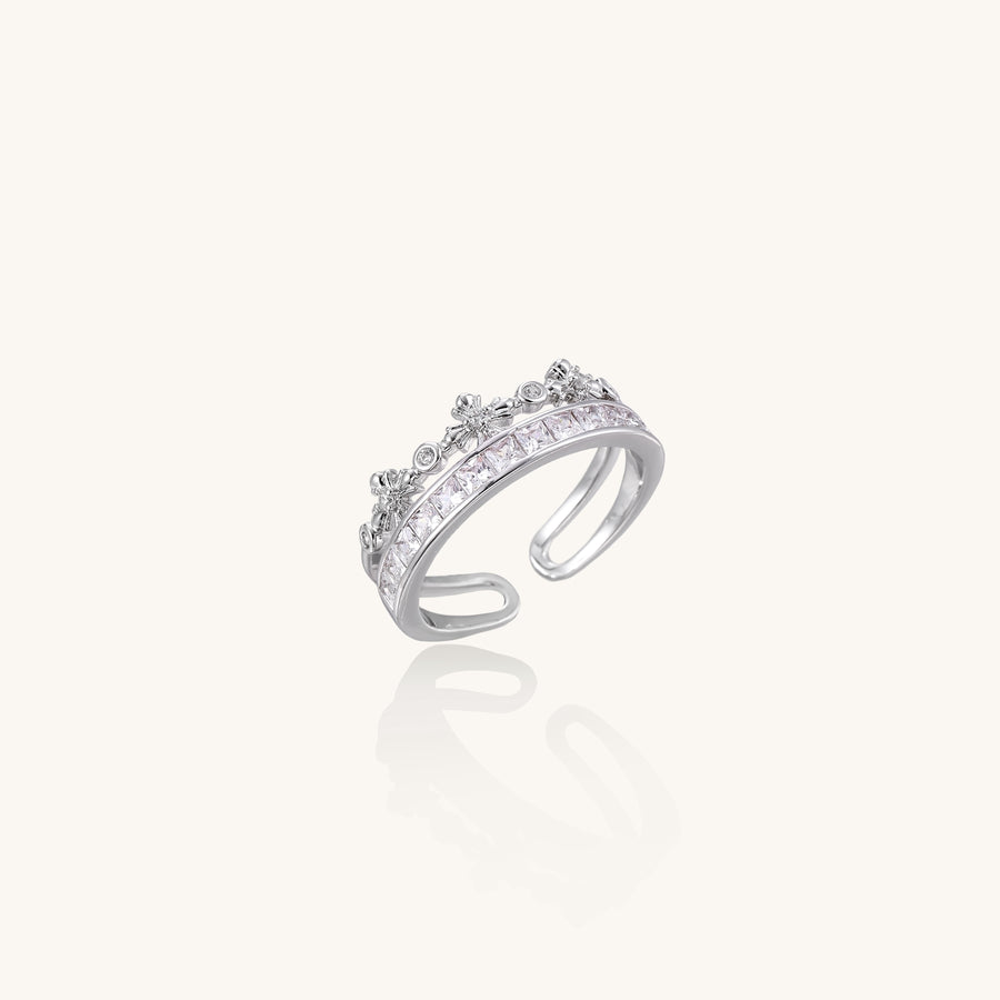 Adjustable gold-plated crown ring with zirconia crystals in ornate tiara design on white background.