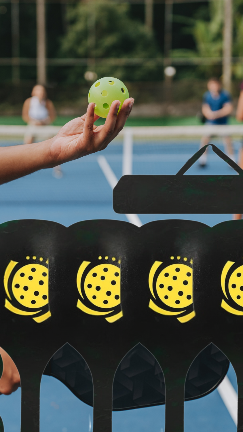 Person holding a pickleball on a court with pickleball stands in the foreground